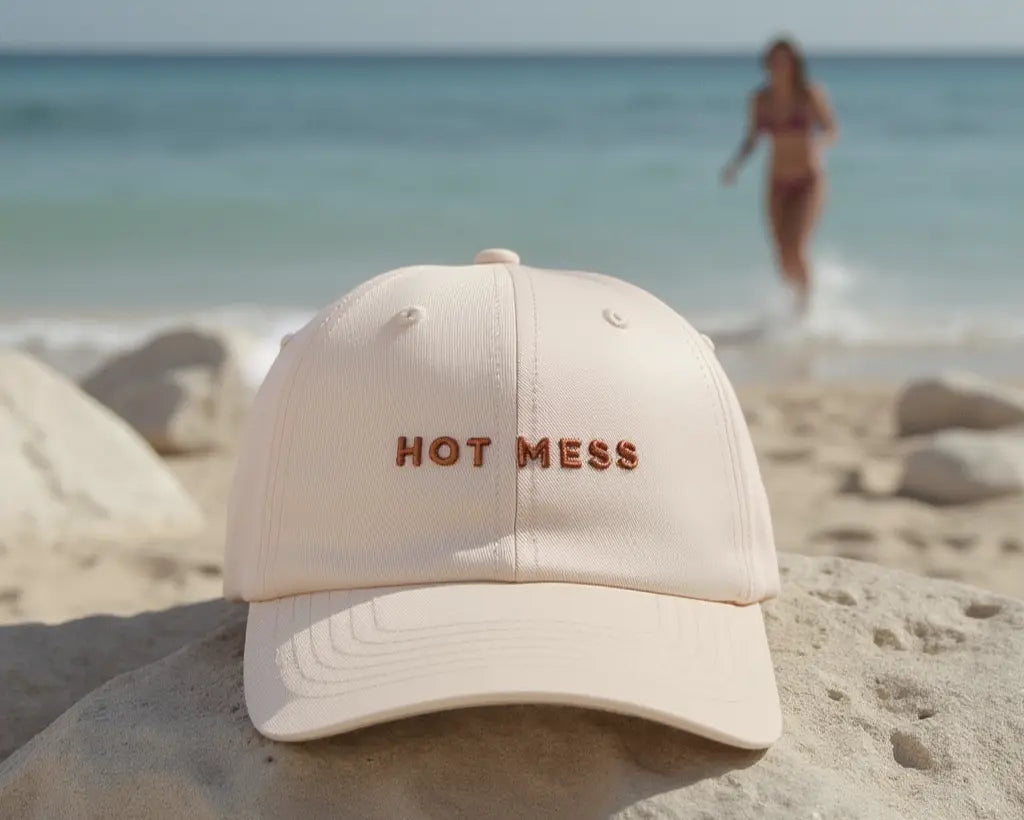 beach with a off white funny trending slogan womens australia beach baseball cap hat hot mess girl in backround in bikini 